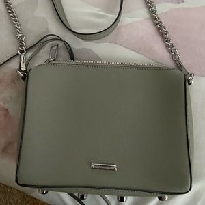 Leather bag with chain detail. Bottom has silver designs. Great shape like new.